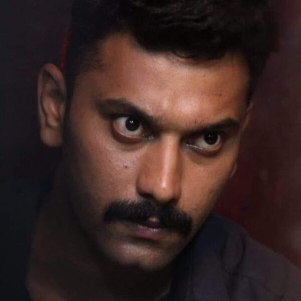 Arulnithi in a police uniform for a Tamil action movie